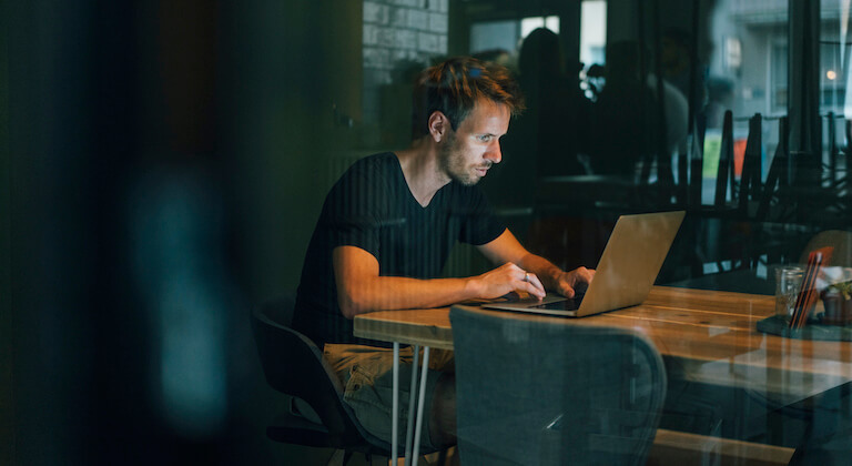 Man sitting in office, working late in his start-up company